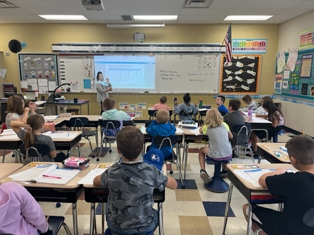 Mrs. Weatherholtz and her class problem solving with math 